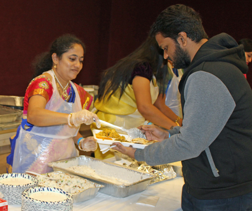 Serving food at Diwali event