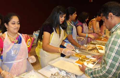Serving food at Kasturi Kannada Diwali event