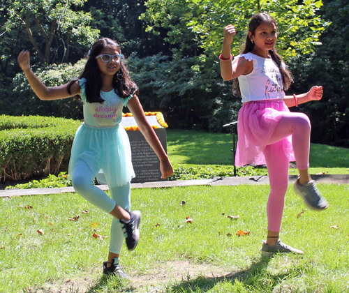 Two young girls perform a Bollywood dance routine