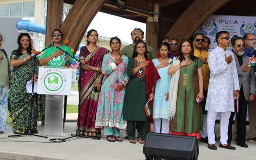 50 civic and community leaders gathered on the India festival USA stage to sing the national anthems of the USA and India