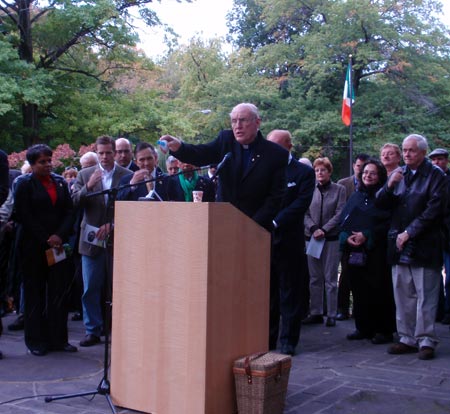 Father Jim O'Donnell blesses the crowd with holy water from Our Lady of Knock