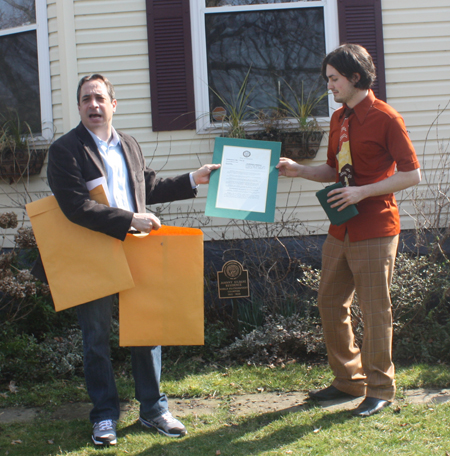 Councilman Matt Zone gives certificate to current owner of the Johnny Kilbane house