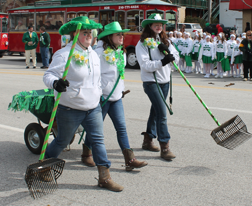 Vleaning up after the horses at the  2013 Cleveland St. Patrick's Day Parade