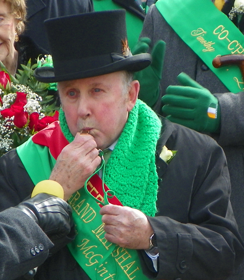 Parade Grand Marshall Kevin McGinty blows whistle to start St Patrick's Day Parade