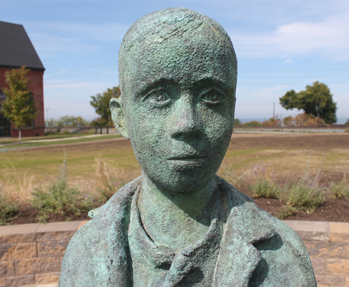young boy part of Johnny Kilbane Statue in Battery Park in Cleveland Ohio