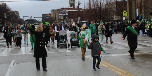 Grand Marshal Mickey Coyne and Family lead the Parade