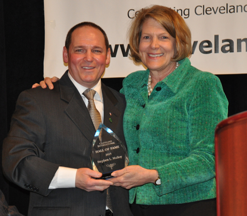 Photo of Steve Mulloy's son Thomas accepting the Cleveland International Hall of Fame award in 2015 from former Mayor Jane Campbell.