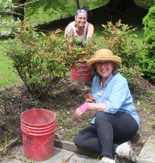 Mary Anne Baucco and Rebecca Spena McCalligan working in the Italian Cultural Garden