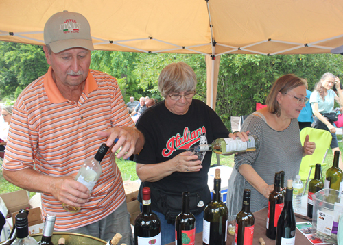 Pouring wine - People at Opera in the Italian Cultural Garden in Cleveland