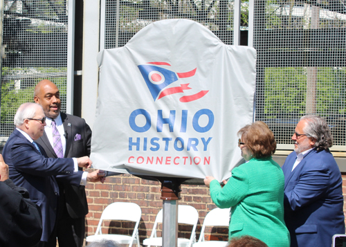 Tom Chema, Blaine Griffin, Joe Marinucci and Mary Fatica Martin unveil the historical marker