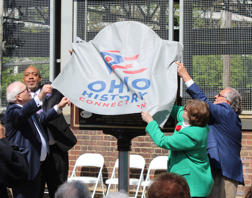 Tom Chema, Blaine Griffin, Joe Marinucci and Mary Fatica Martin unveil the historical marker