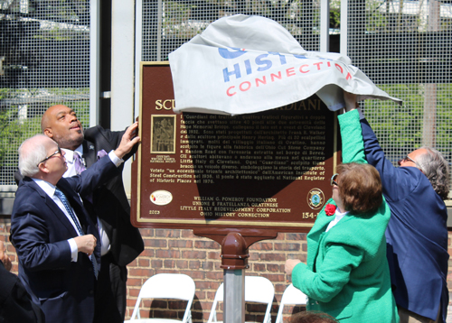 Tom Chema, Blaine Griffin, Joe Marinucci and Mary Fatica Martin unveil the historical marker