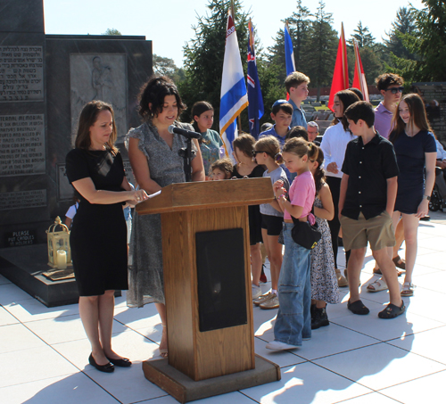 The seventh candle was lit by the great-grandchildren of Holocaust survivors