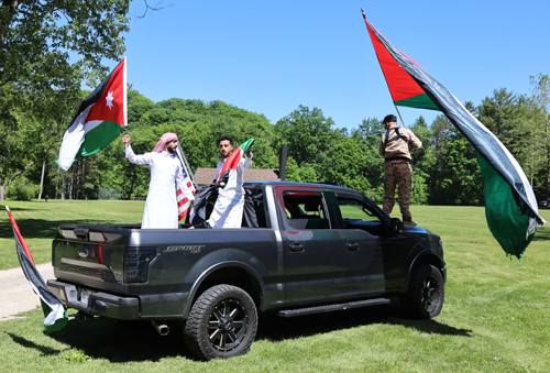 Cars parading with flags of Jordan