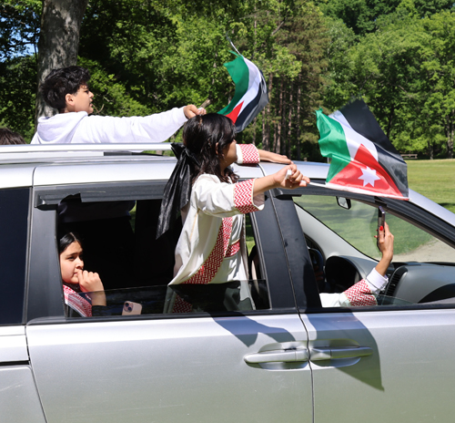 Cars parading with flags of Jordan
