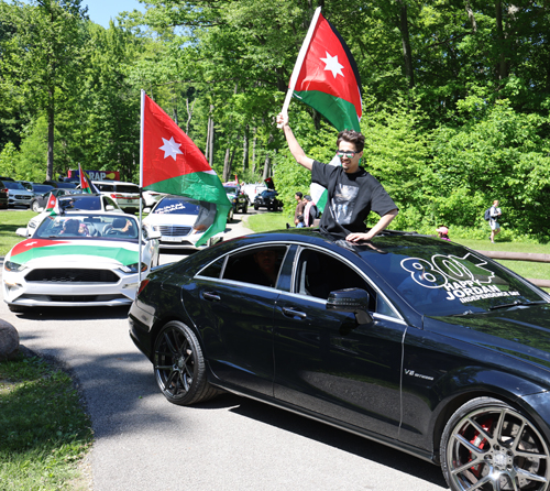 Cars parading with flags of Jordan