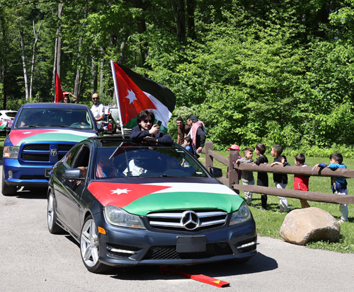 Cars parading with flags of Jordan