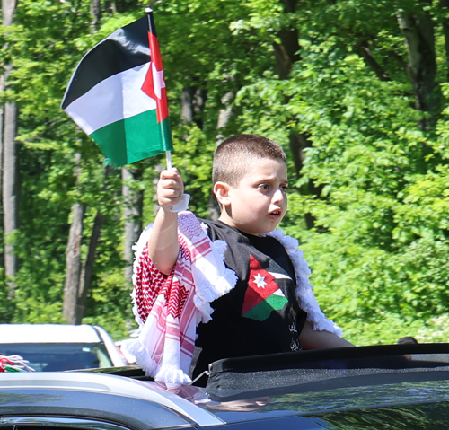 Cars parading with flags of Jordan