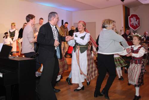 Youngsters from Svyturiukai Lithuanian Folk Dance Group  with audience