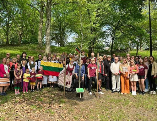 Attendees planting the oak tree