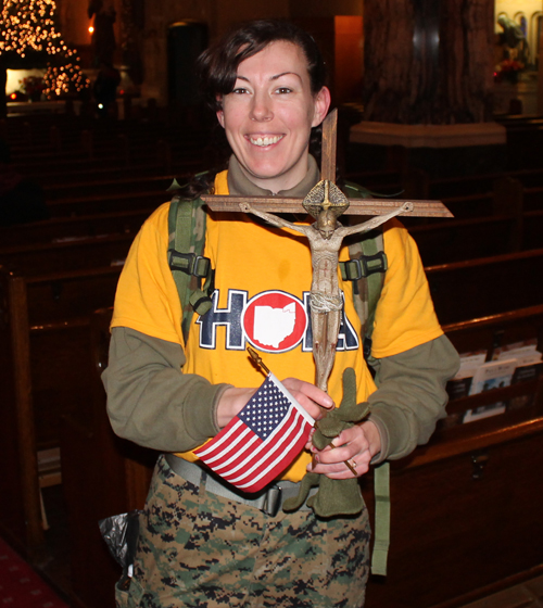 Marcher with a Cross and US Flag