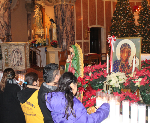 Praying in front of icon of Our Lady of Czestochowa