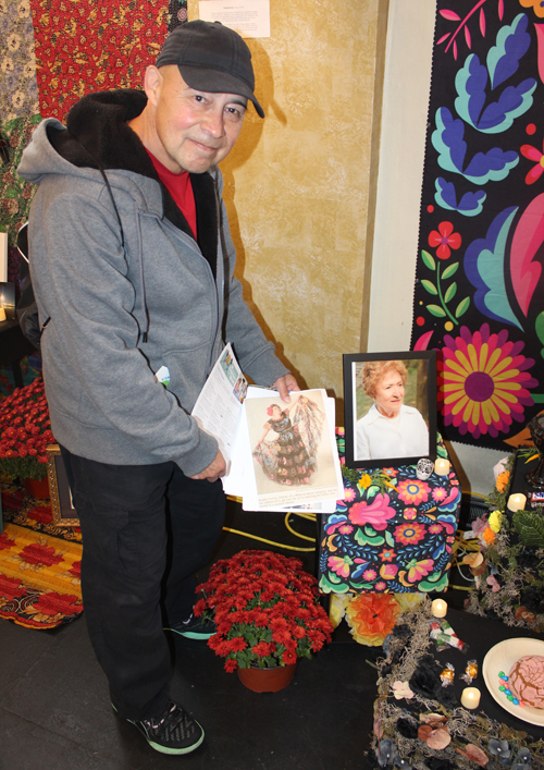 Angel Galvan showing a picture of his mother