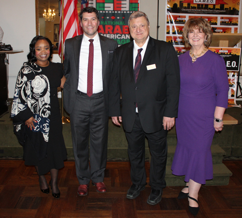 Judge Christopher Woodworth with his bailiff and Pierre and Mary Bejjani