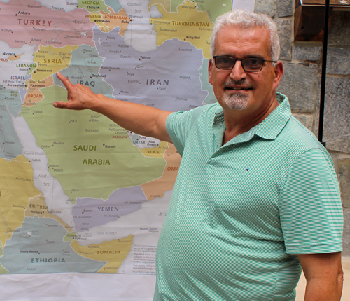 George Koussa pointing to Syria
