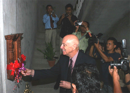 U.S. Cultural Envoy Dr. Gene Aitken begins his first day in Nepal by cutting the ribbon to inaugurate the Kathmandu Jazz Conservatory in 2008