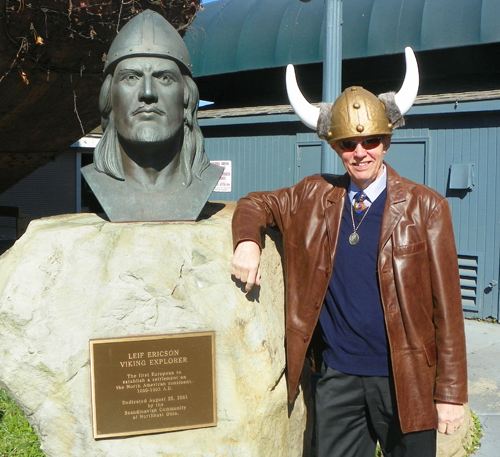 Bengt Gerborg with Viking Hat in front of bust of Leif Ericson