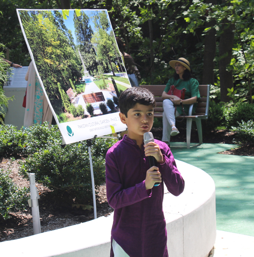 Boy recites prayer in Pakistan Garden