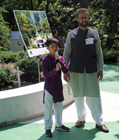 Boy recites prayer in Pakistan Garden