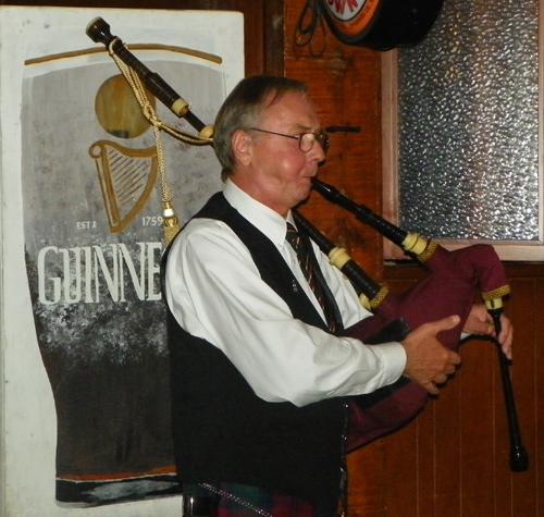 Bruce Grieg playing the bagpipes