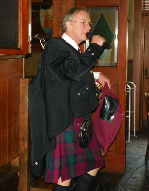 Bruce Grieg showing the piper's outfit