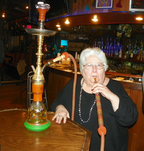 Nancy Loren smoking a hookah