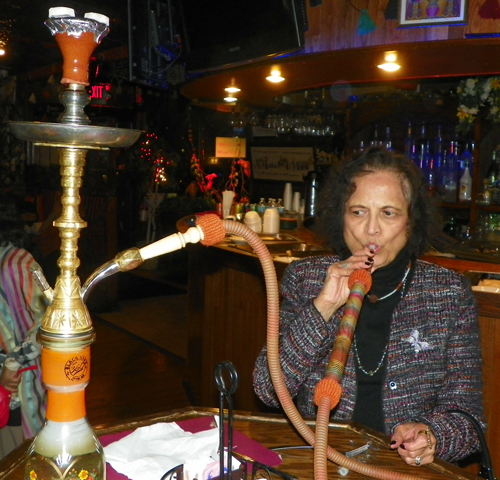 Saroj Aggarwal smoking a hookah