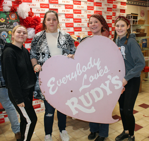 Everybody loves Rudy's sign with Lidia Trempe and staff