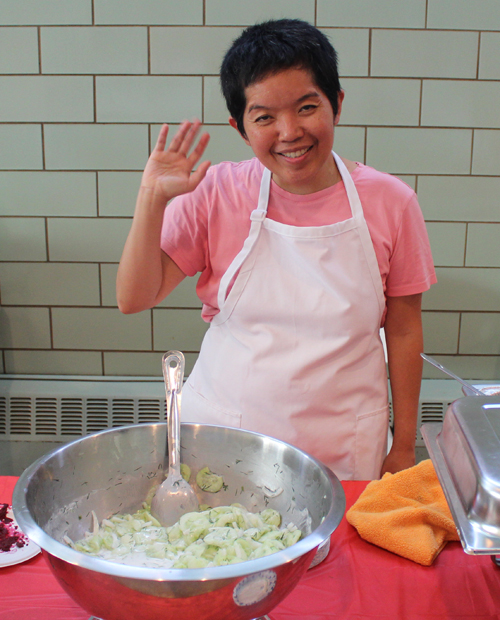 Volunteer serving Polish food at Taste of St Casimir
