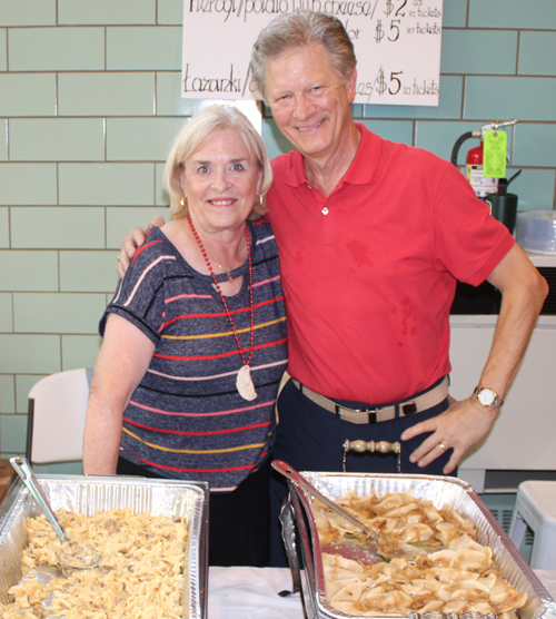 Volunteer serving Polish food at Taste of St Casimir