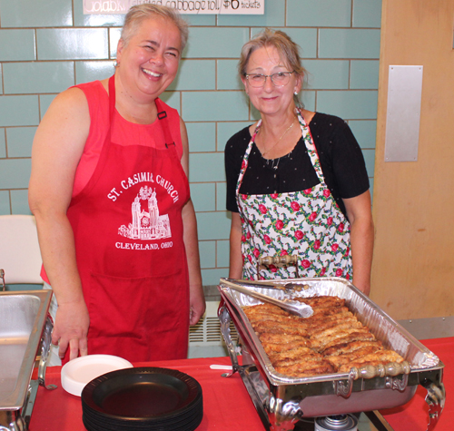 Volunteer serving Polish food at Taste of St Casimir