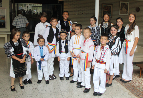 Young boys and girls in traditional Romanian costumes