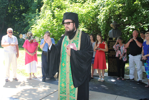 Fr. Neftaria blesses the bust of Jovan Ducic