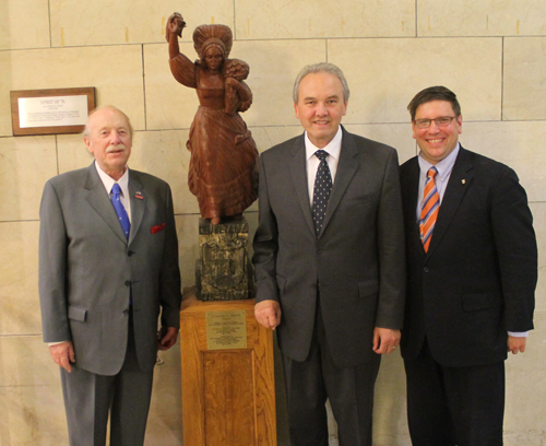 August Pust, Slovenian Ambassador to US Roman Kirn and Joe Cimperman with the statue in June 2013