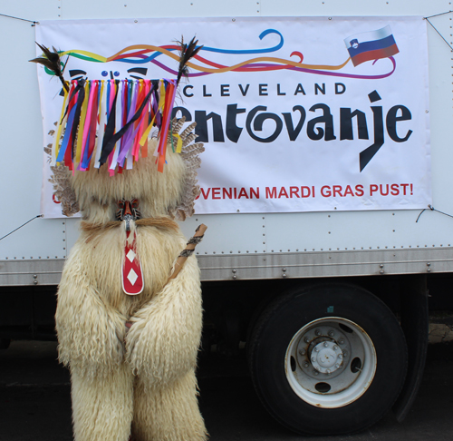 Kurent in front of Cleveland Kurentovanje sign