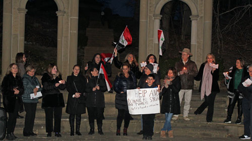 Syrian flags in front of Arch of Palmyra