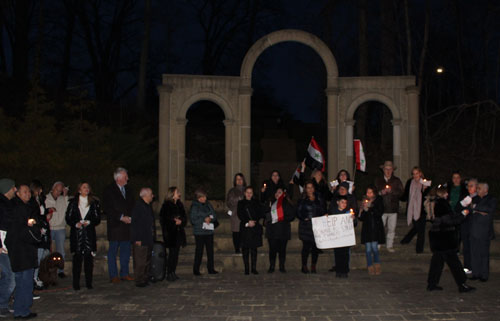 Syrian flags in front of Arch of Palmyra